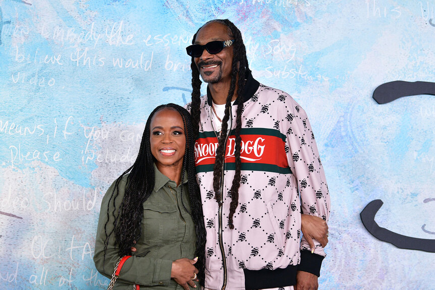 Shante Broadus and Snoop Dogg pose for photos at the premiere of "Dear Mama"