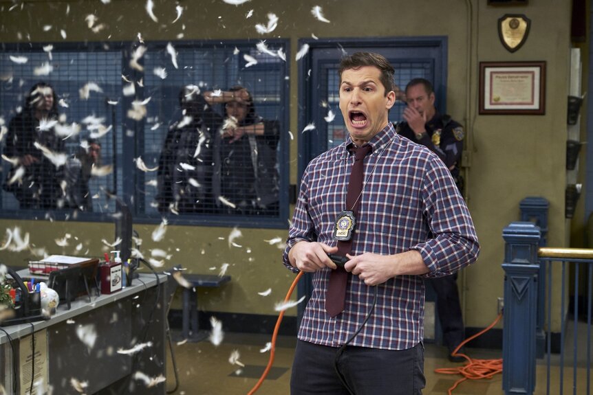 Jake Peralta screams at white confetti in Brooklyn Nine-Nine Episode 516.