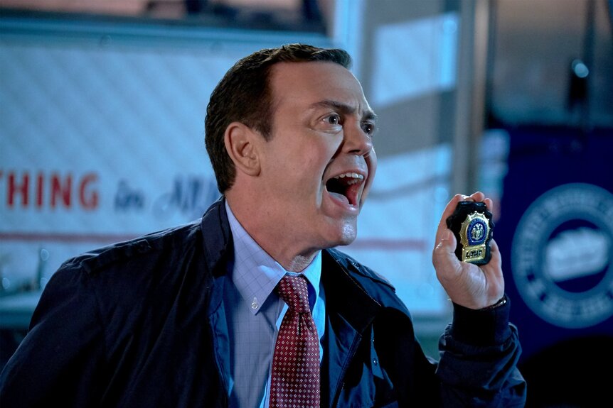 Charles Boyle holds up his police badge in Brooklyn Nine-Nine Episode 517.