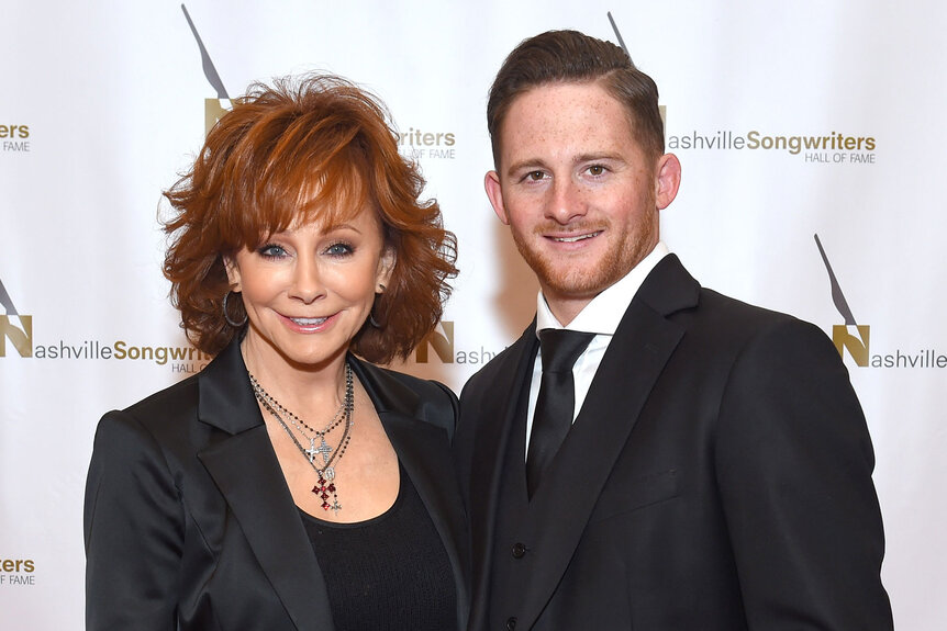 Reba McEntire and her son Shelby Blackstock pose on the red carpet of the 2018 Nashville Songwriters Hall Of Fame Gala