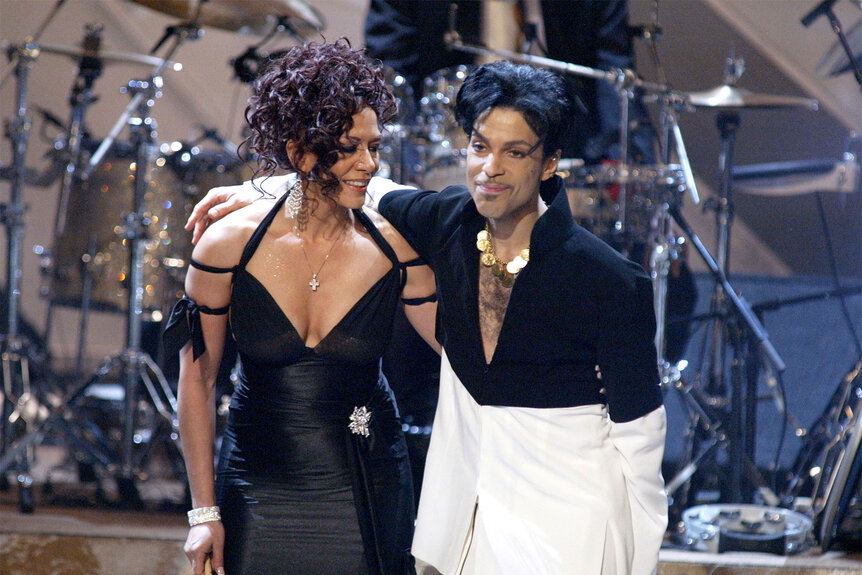 Sheila E. and Prince embrace onstage during The 36th Annual NAACP Image Awards