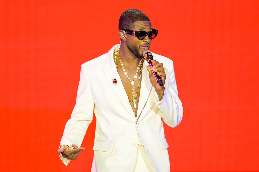 Usher Performing in a white suit during his Vegas residency