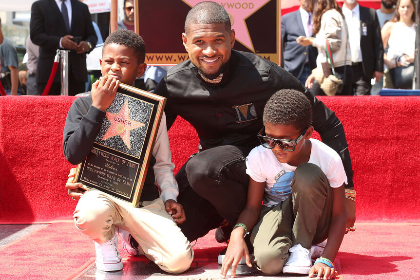 Usher and sons Usher Raymond V and Naviyd Ely Raymond attend the ceremony honoring Usher with a star on the Hollywood Walk of Fame in 2016