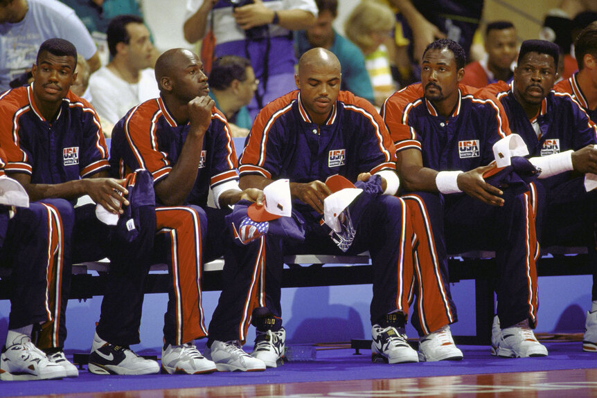 USA David Robinson, Michael Jordan, Charles Barkley, Karl Malone and Patrick Ewing sit on the sideline