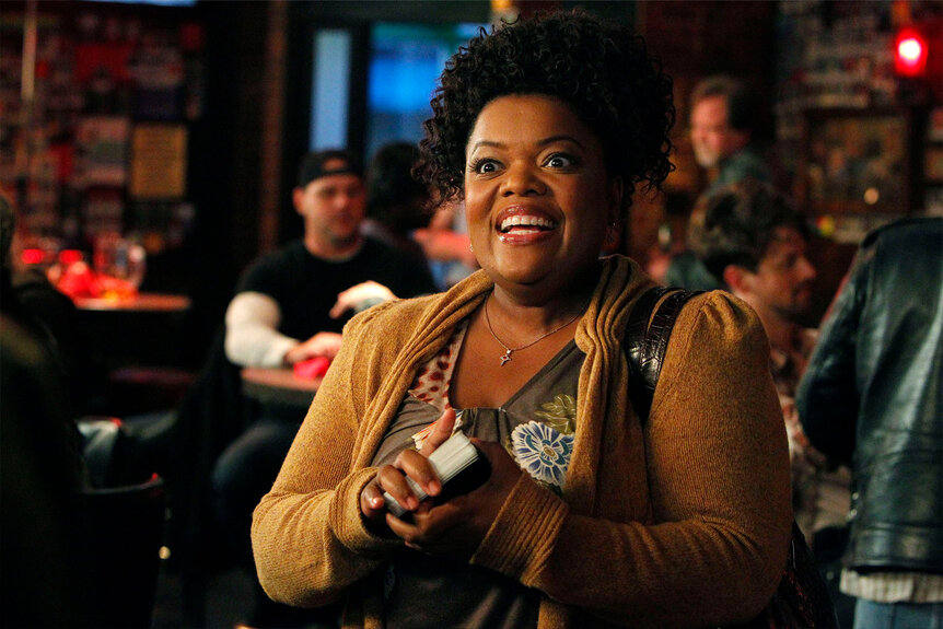Shirley (Yvette Nicole Brown) smiles at someone offscreen
