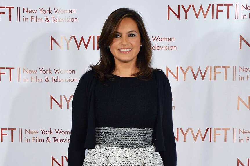 Mariska Hargitay smiles in a black and white outfit.