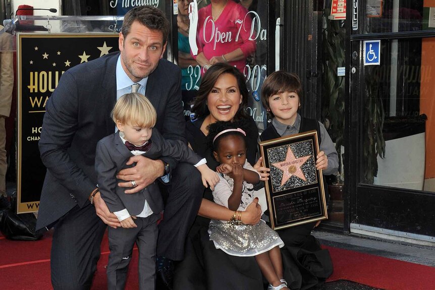Mariska Hargitay and her family pose on The Hollywood Walk of Fame.