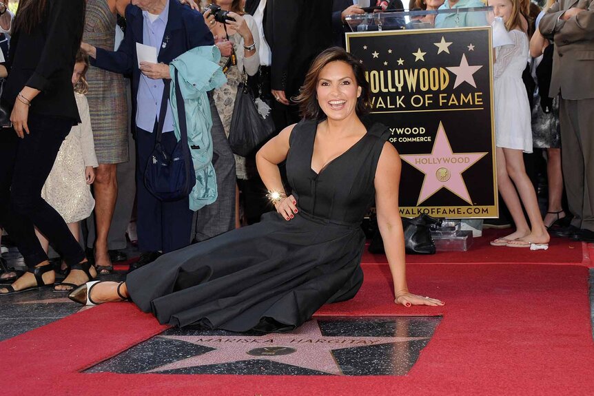 Mariska Hargitay poses with her star on The Hollywood Walk of Fame.