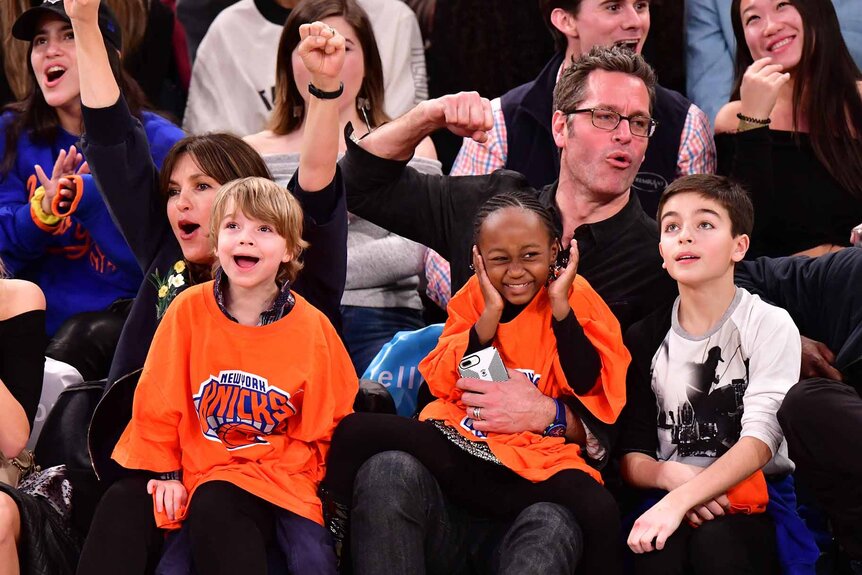 Mariska Hargitay and Peter Hermann attend a basketball game with their children.
