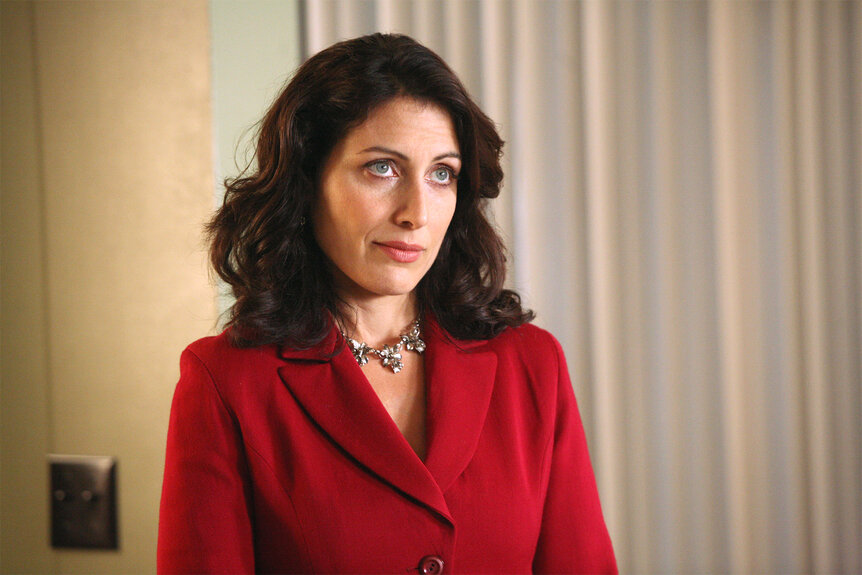 Dr. Lisa Cuddy wears a red blazer on House Episode 310