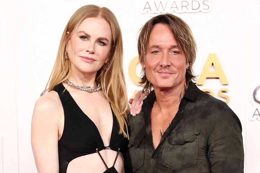 Keith Urban and Nicole Kidman pose together on the red carpet for the 2023 CMA Awards