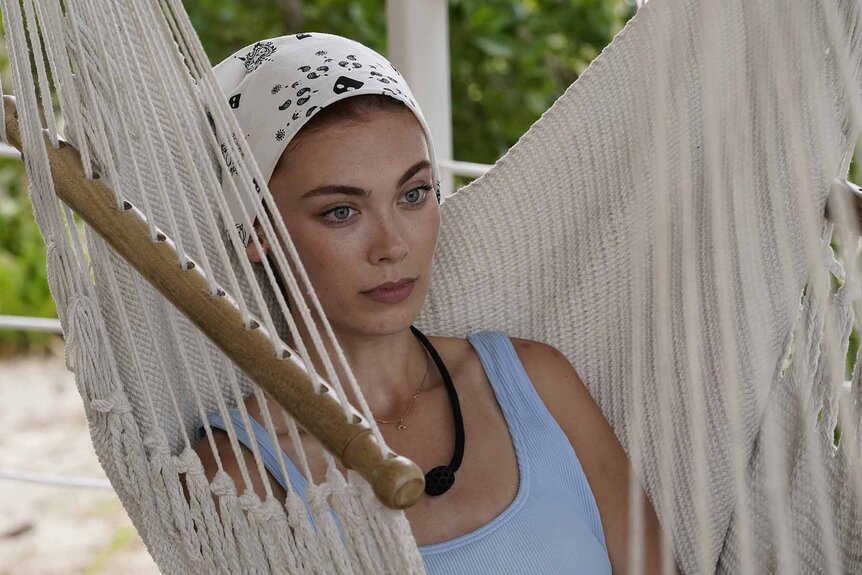 Alyssa Klinzing sits in a hammock in Deal or No Deal Island Episode 104.