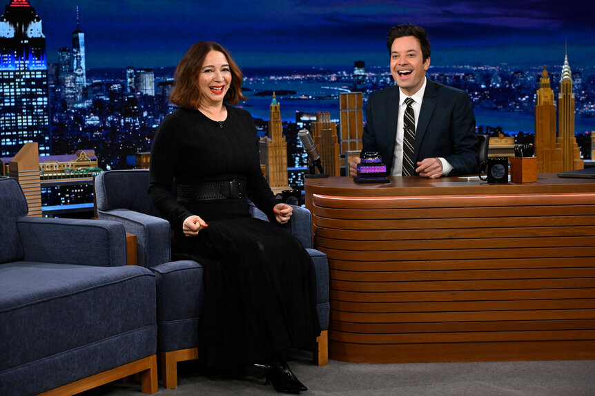 Maya Rudolph and Jimmy Fallon smile at the audience