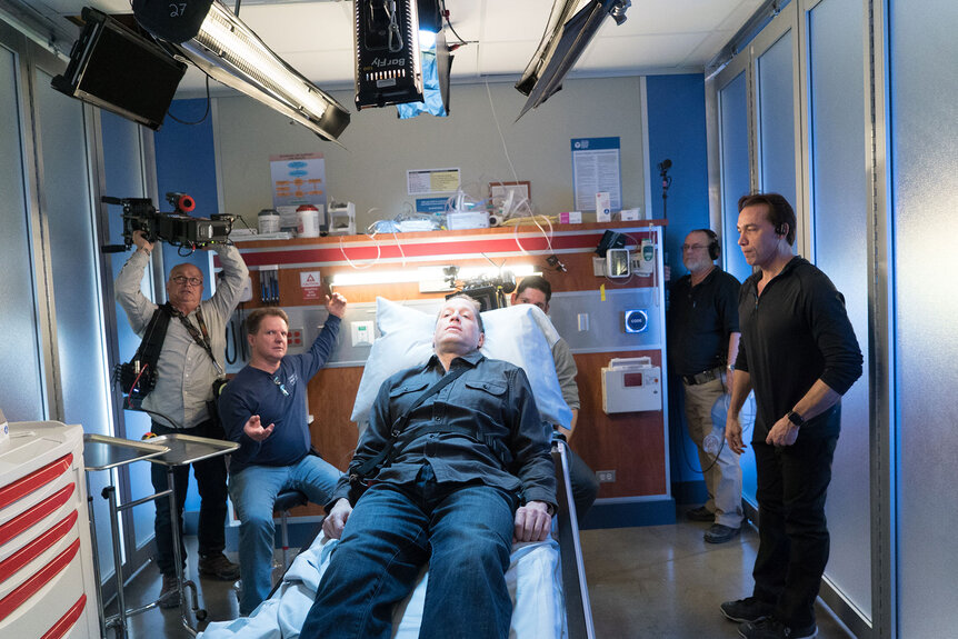 The crew preps lighting in an ER room for a scene during Chicago Med Season 1 Episode 11