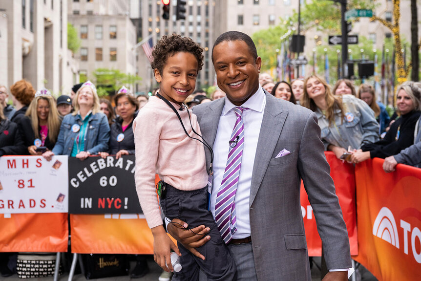 Craig Melvin holds his son Delano