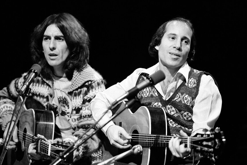 George Harrison and Paul Simon perform on Saturday Night Live on November 20, 1976.