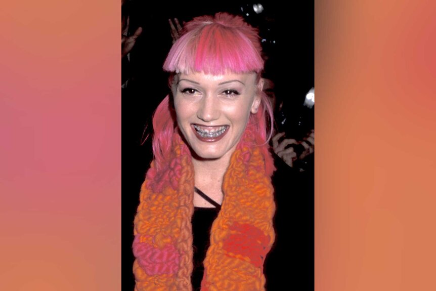 Gwen Stefani in 1999 with pink hair and braces