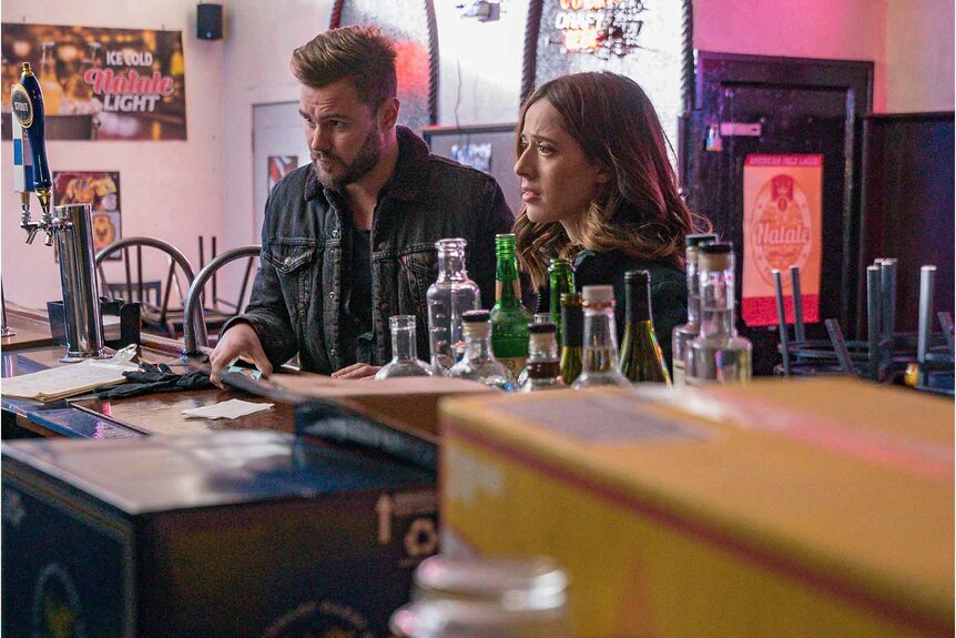 Adam Ruzek and Kim Burgess sit at a bar in Chicago P.D Episode 619.