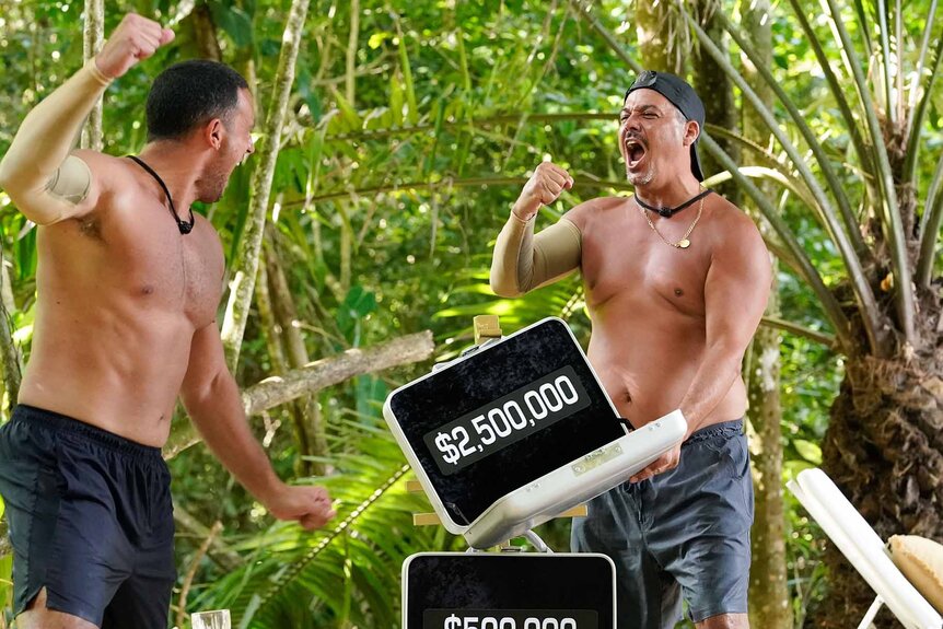 Nicholas Grasso and Rob Mariano pump their fists to a $2.5 million briefcase on Deal or No Deal Island Episode 107,