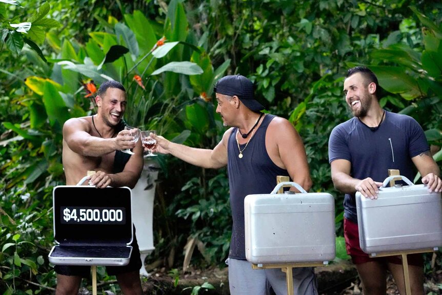 Nicholas Grasso and Rob Mariano fist bump while Dawson Addis looks on in Deal or No Deal Island Episode 108.
