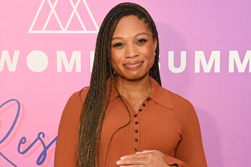 Allyson Felix stand son the red carpet of TheWrap Presents Power Women Summit