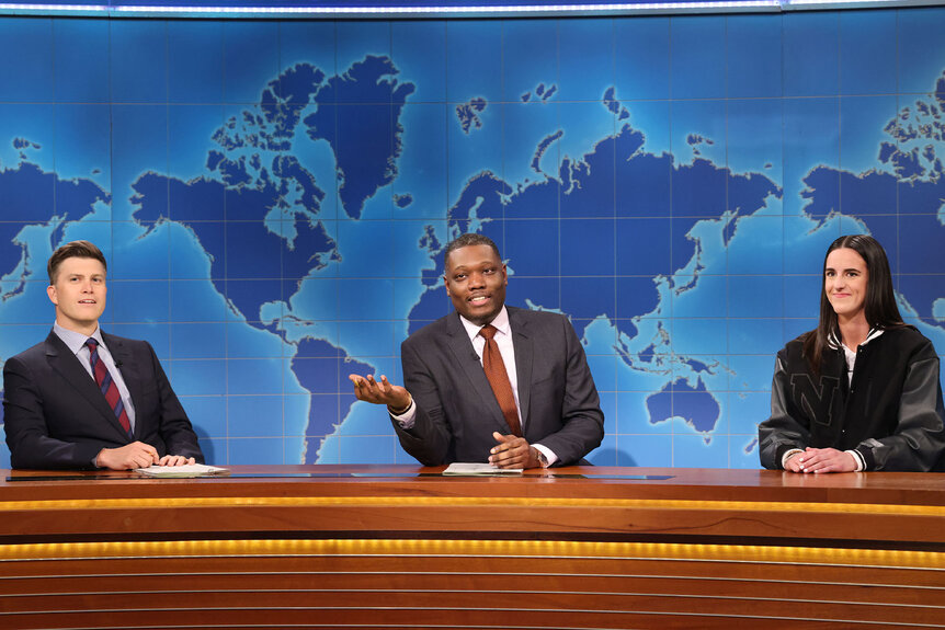 Colin Jost, Michael Che, and Caitlin Clark appear during Weekend Update on Saturday Night Live Episode 1861 on April 13, 2024.