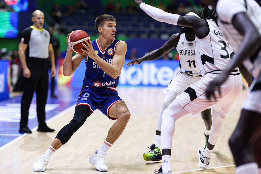 Bogdan Bogdanovic #7 of Serbia drives the ball during the first round Group B match between South Sudan and Serbia