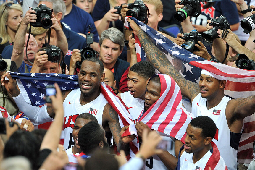LeBron James, Kevin Durant, Anthony Davis and Carmelo Anthony of the United States celebrate after they won against Spain during the 2012 Olympics