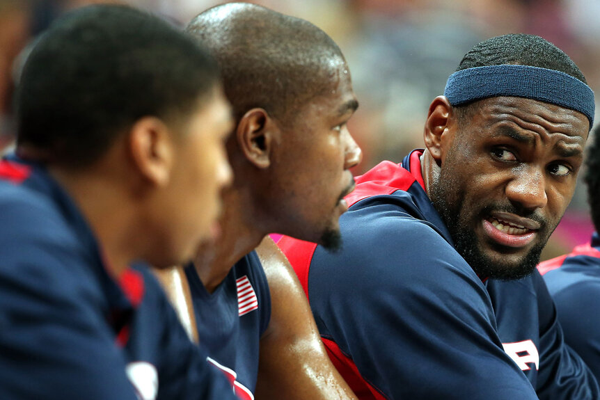 LeBron James talks to teammates Kevin Durant and Anthony Davis during the Men's Basketball Preliminary Round match on Day 4 of the London 2012 Olympic Games
