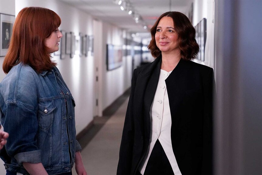 Maya Rudolph and Chloe Troast in a hallway during promos for Saturday Night Live