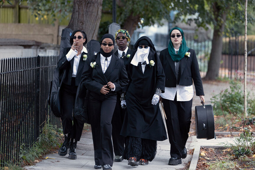 Saira, Amina, Bisma, Momtaz, and Ayesha walk down the street in a scene from We Are Lady Parts Season 2 Episode 3